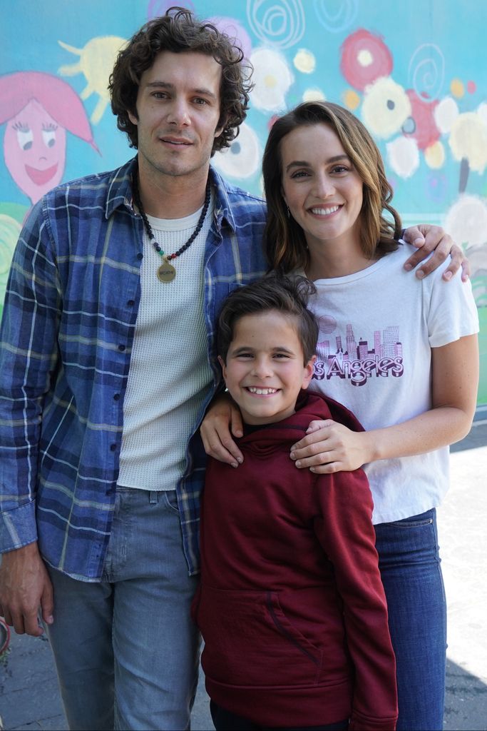 Adam Brody and Leighton Meester with their son on screen