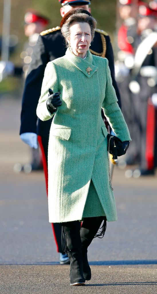 Princess Anne in knee-high boots and seafoam green coat