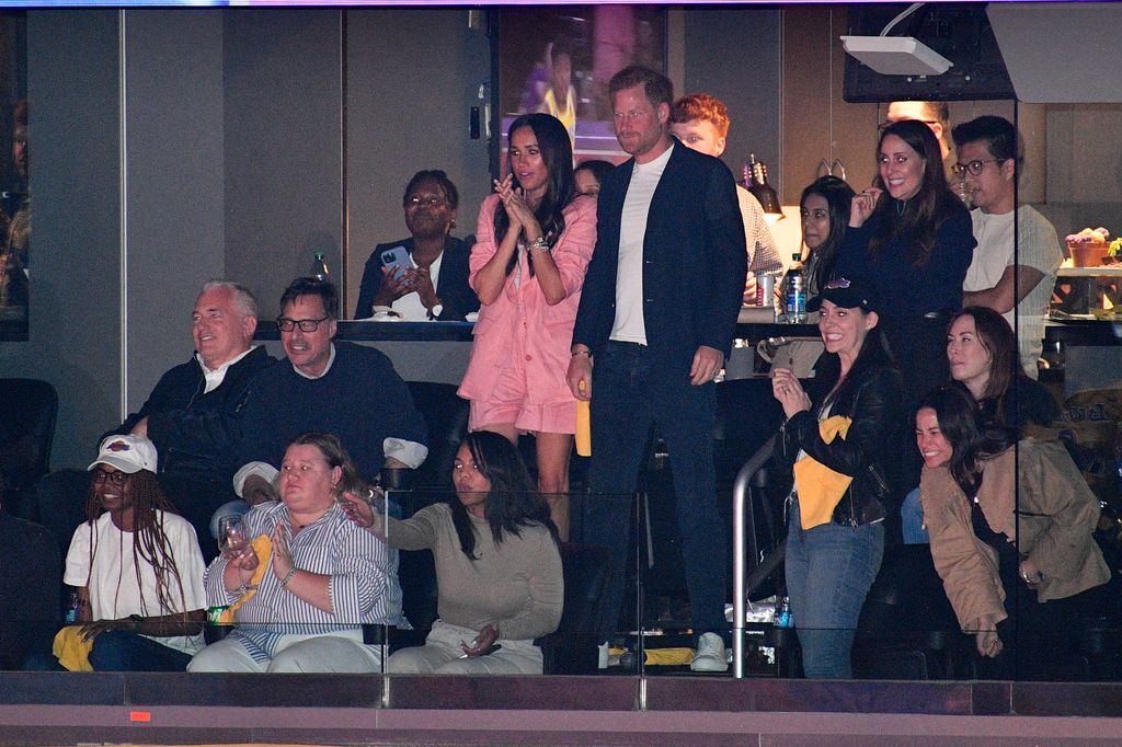 Meghan Markle and Prince Harry watching an NBA game