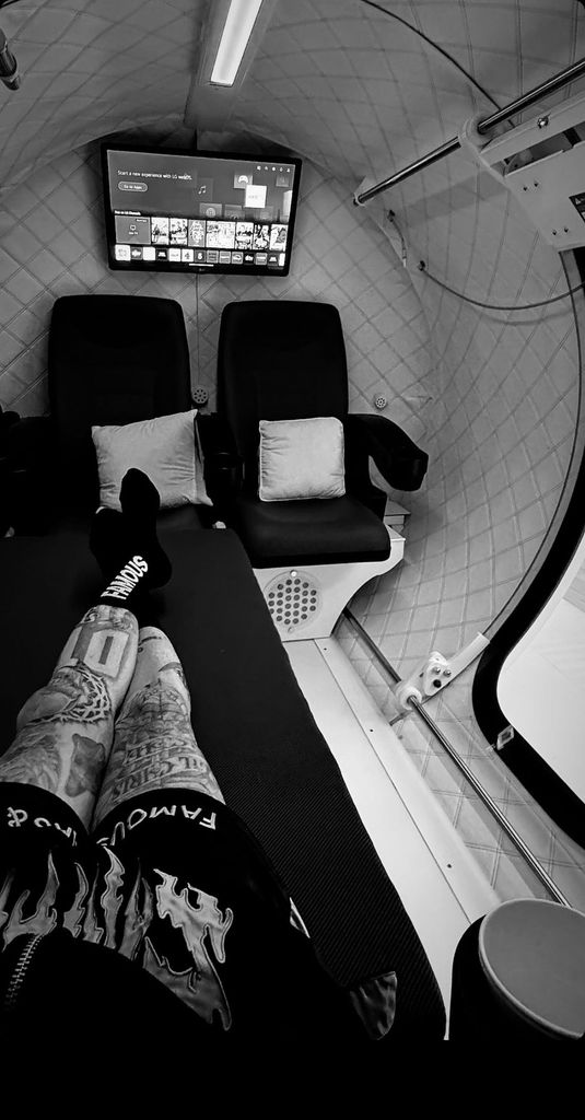 Travis Barker inside an oxygen chamber at home