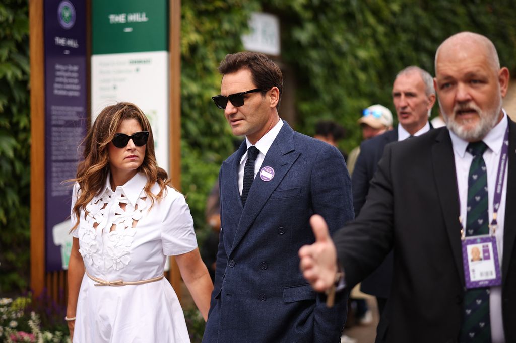 Switzerland's Roger Federer and his wife Miroslava Vavrinec arrive on the eighth day of the 2025 Wimbledon Championships