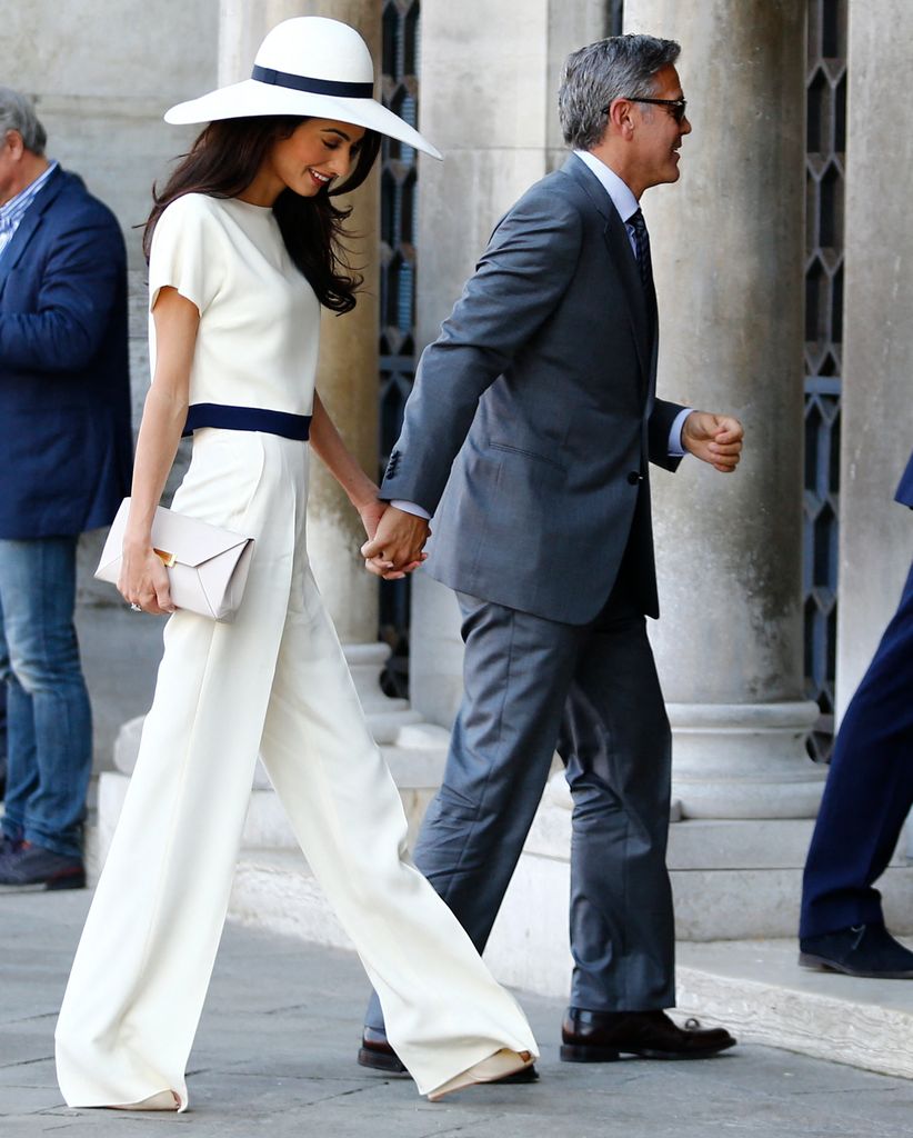 The pair arriving at the Palazzo Ca Farsetti in Venice