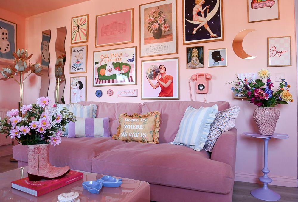pink sofa with gallery wall behind
