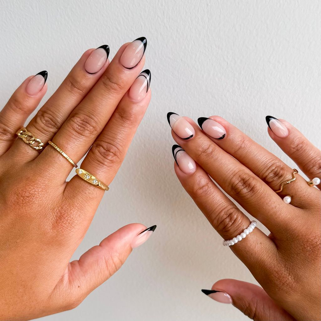 Womens Hands With Black French Nails
