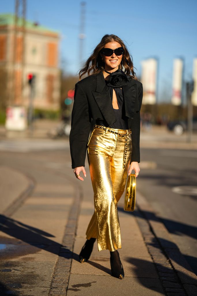 Nina Sandbech going for gold as she attends a fashion week show 