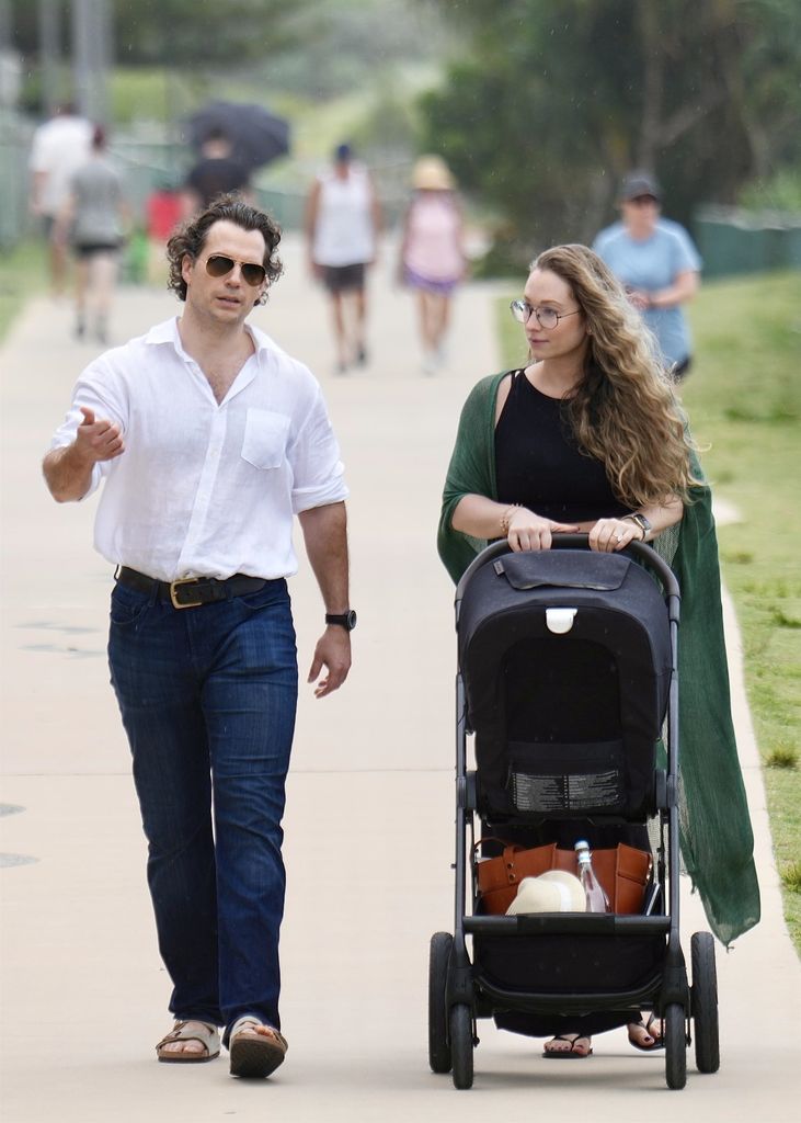 Henry Cavill and partner Natalie Viscuso spotted on the Gold Coast with baby taking a walk