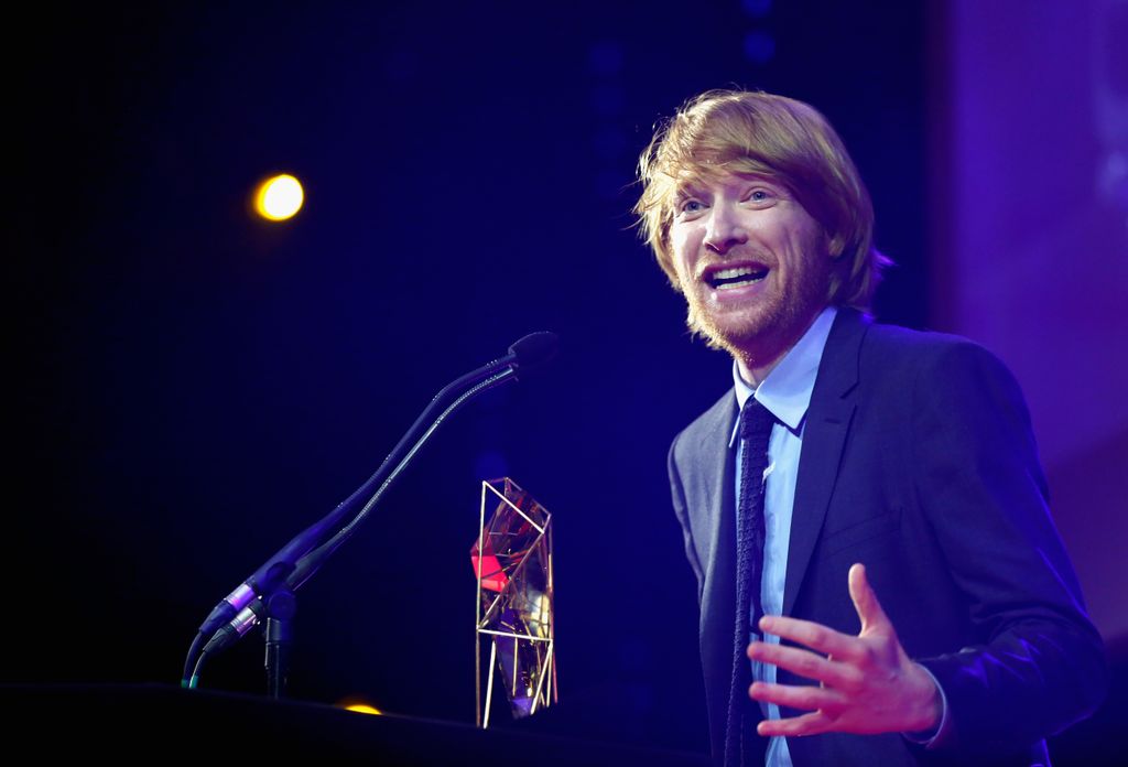 Domhnall Gleeson accepts the award for Best Supporting Actor on behalf of his father Brendan Gleeson 