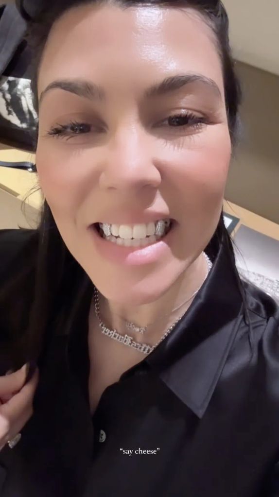 Kourtney shows off her diamond encrusted grill