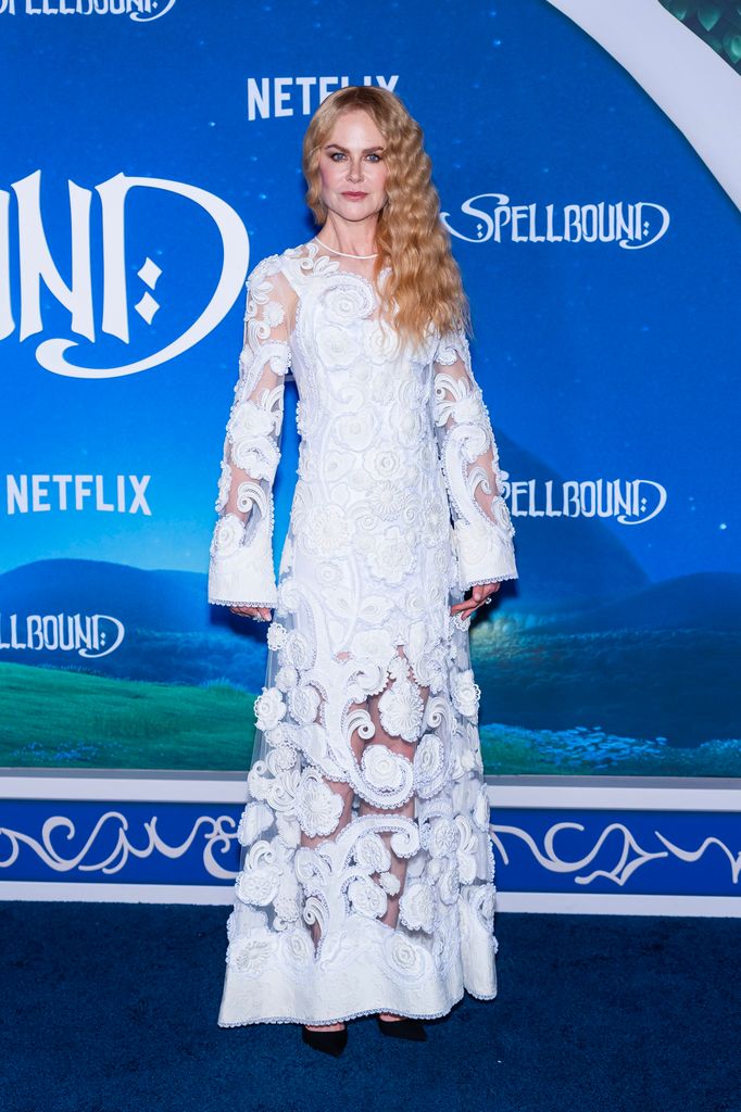 Nicole Kidman on red carpet in white cut out gown