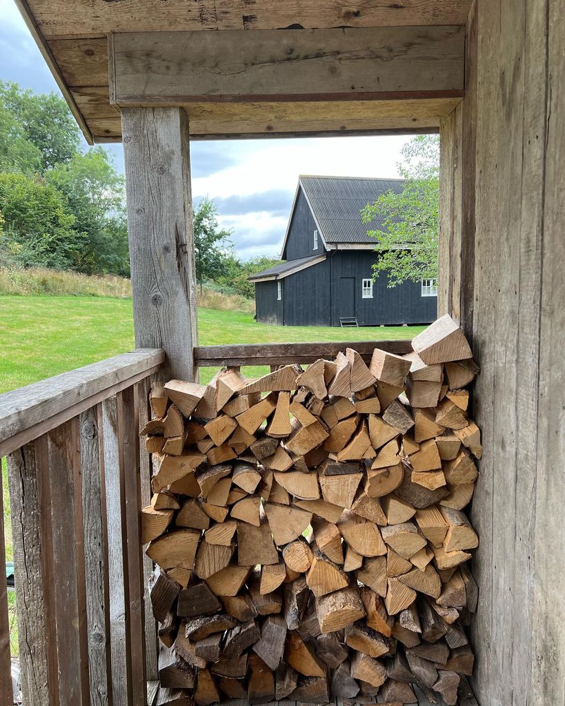 A Soho Farmhouse veranda with logs