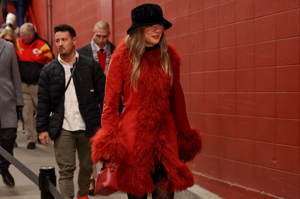 Taylor Swift in a red Charlotte Simone coat in December 2024