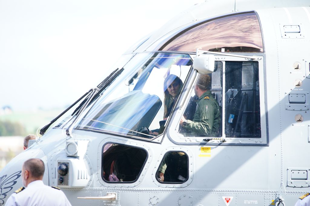 The Princess of Wales sits inside the cockpit of a Merlin Mk2 helicopter