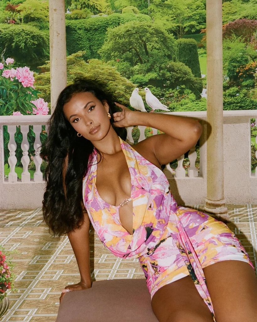 maya jama in a slinky pink-yellow mini dress with her hair down