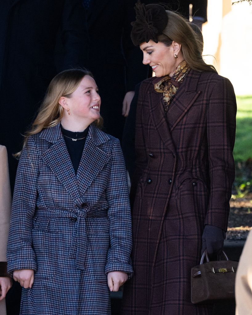 Mia Tindall smiling at Kate Middleton