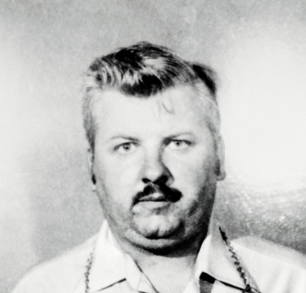 This is a police photo of John Wayne Gacy, 37, being held for questioning in connection with the discovery late 12/21 of five badly decomposed bodies. The bodies, believed to be of young people, were found in the crawl space of a home owned by Gacy. He operated a construction business from his home and employed several young men, neighbors said.