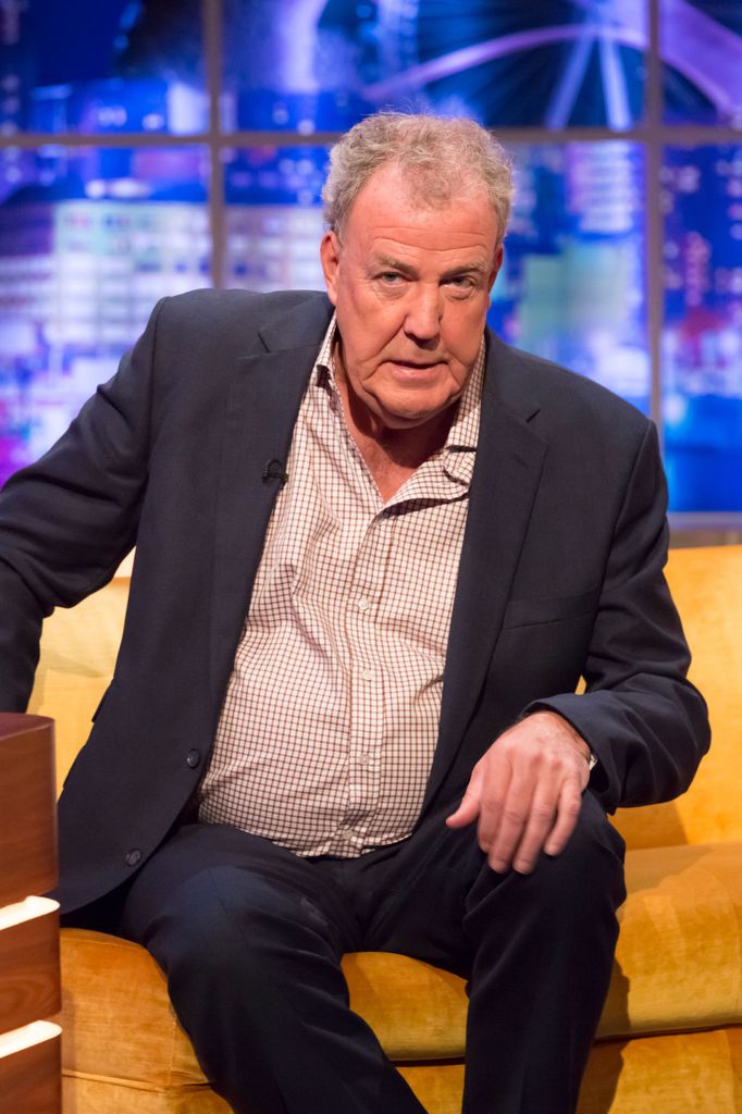 Jeremy Clarkson looking concerned while sitting on a sofa