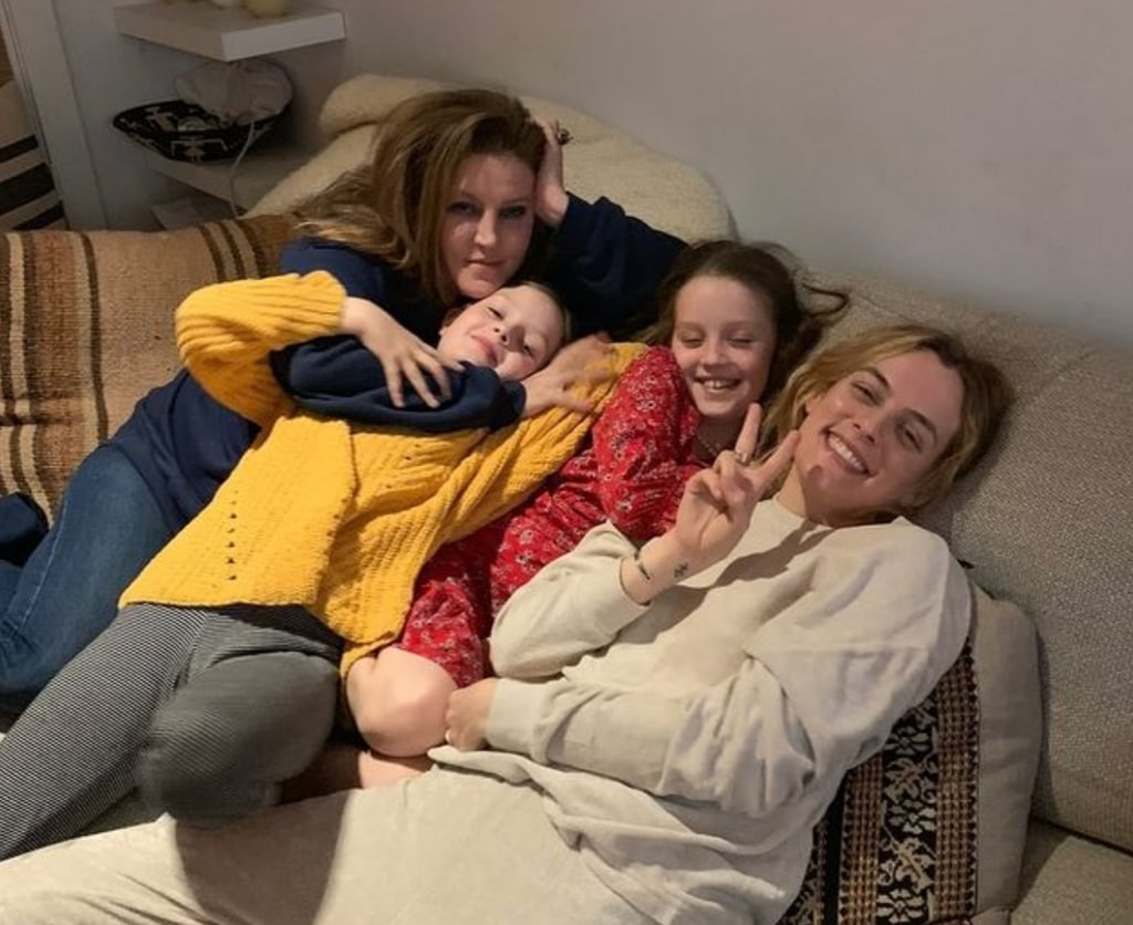 Photo shared by Riley Keough on Instagram October 2024 featuring her younger twin sisters Harper and Finley and their mom Lisa Marie Presley in honor of their 16th birthday