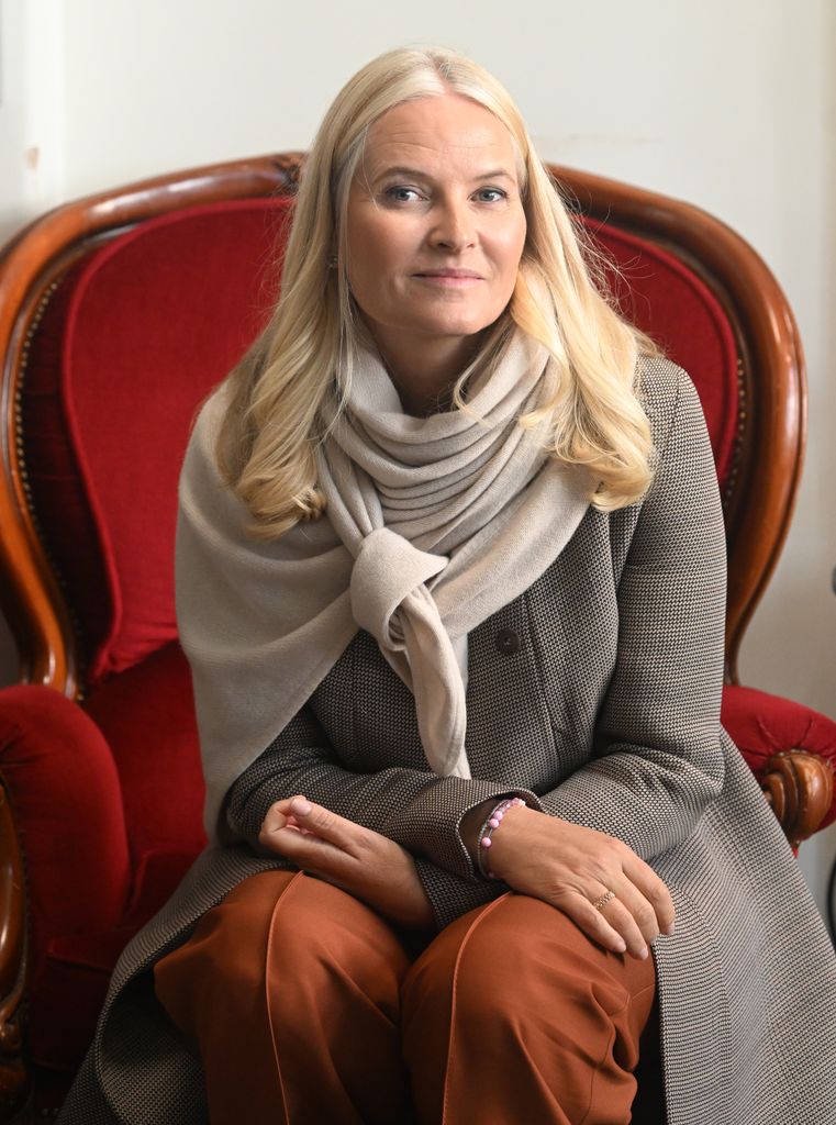 Crown Princess Mette-Marit wearing scarf and coat