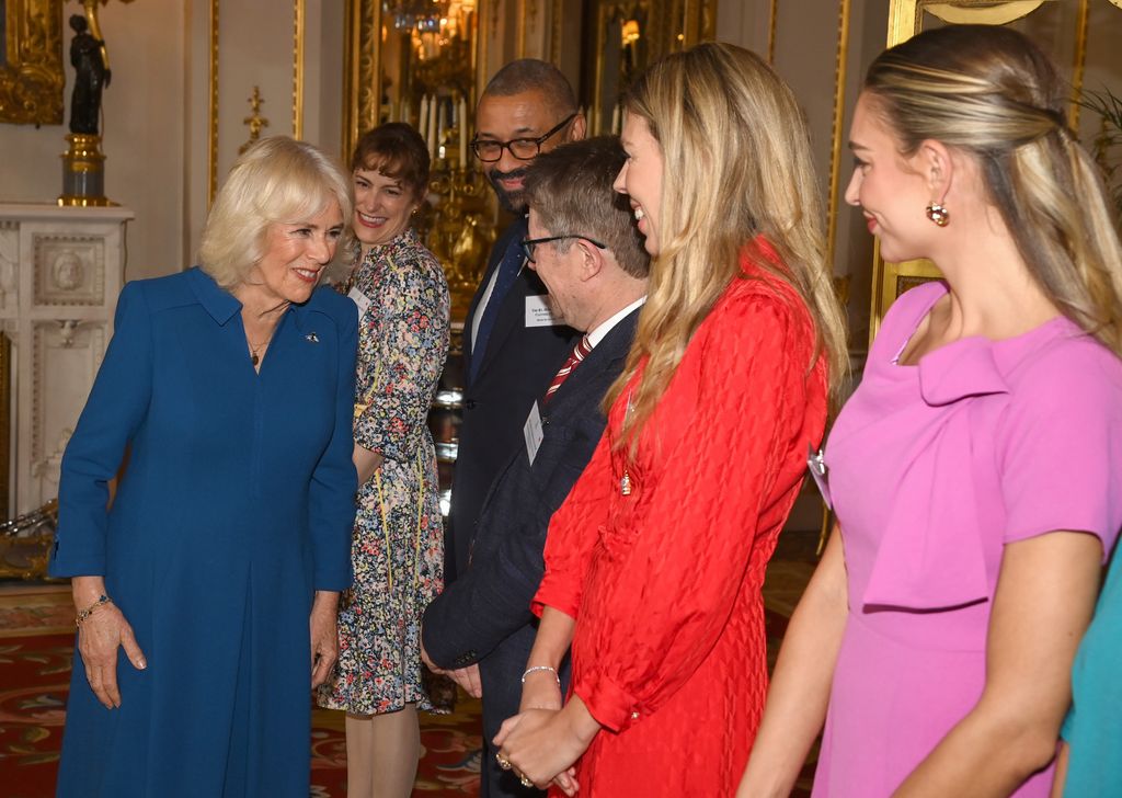 Queen Camilla smiles as she speaks with Shadow Minister for Victims and Sentencing Kevin Brennan 