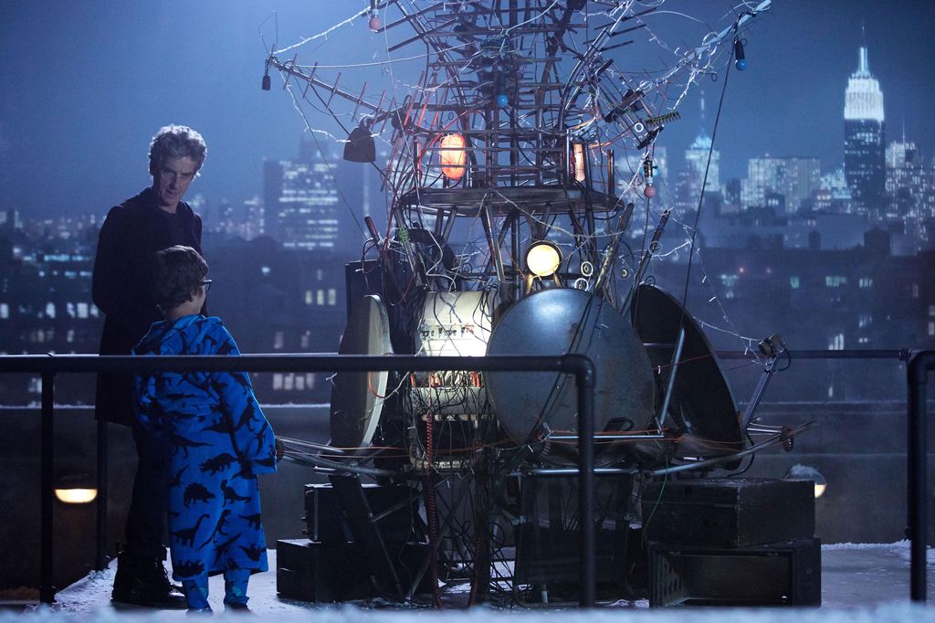 A still of Peter Capaldi and a young child in Doctor Who