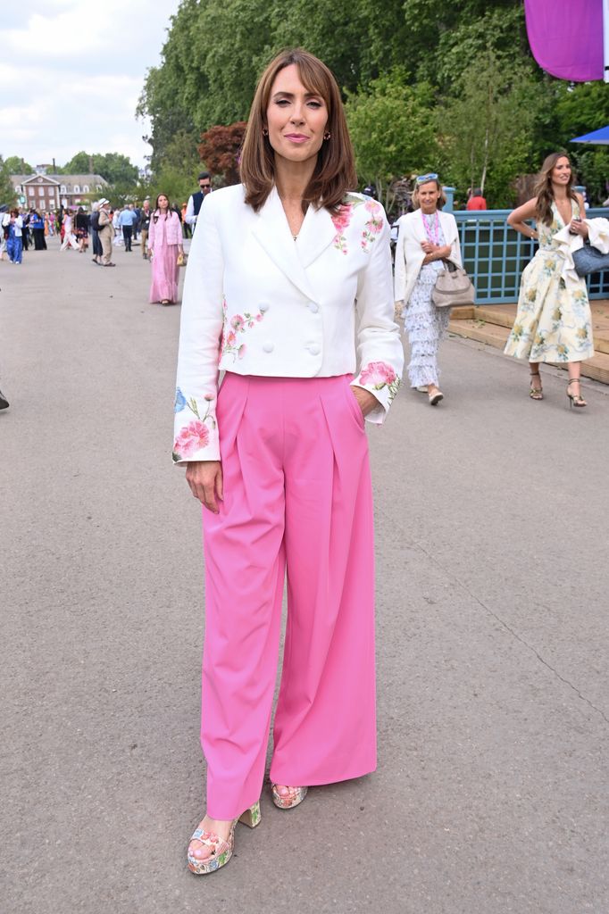 Alex Jones wears a white floral blazer and bright pink trousers with floral heels at the Chelsea Flower Show.