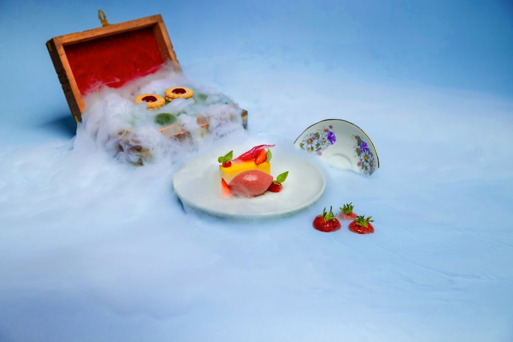 Six by Nico food on a plate surrounded by smoke