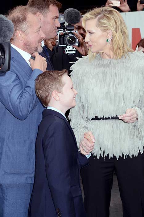 Cate Blanchett on a red carpet with her son Ignatius and her husband Andrew