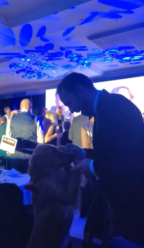 James Middleton dancing with a dog