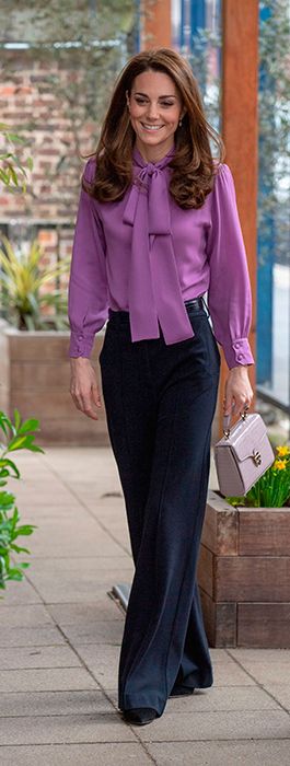 Kate Middleton Wears a Chanel Bag, Green Pants & Purple Sweater