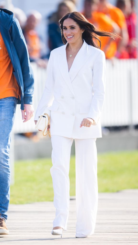 Meghan in a white suit 