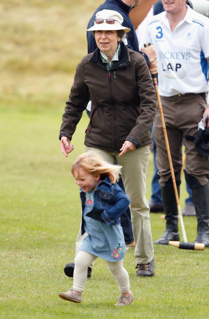 Princess Anne smiles as she chases after granddaughter Mia Tindall