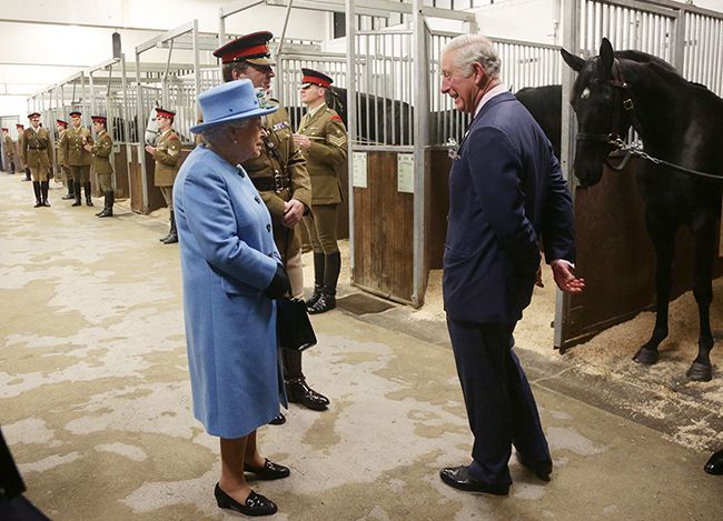 the queen and prince charles visit horses at barracks