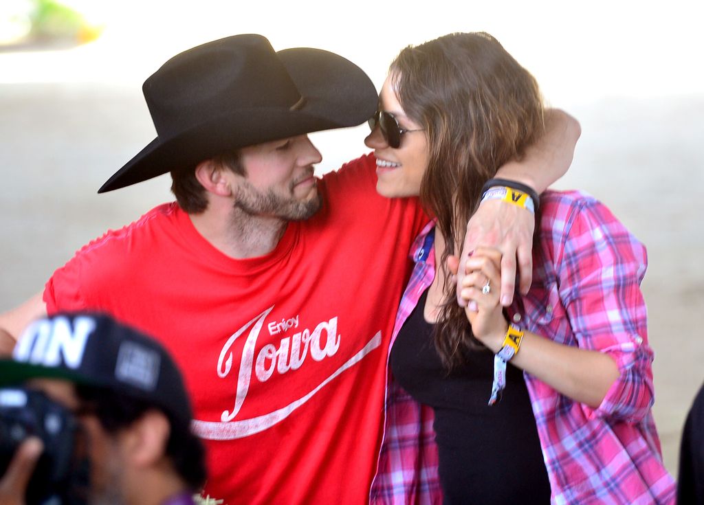 Ashton Kutcher and Mila Kunis attend day 1 of 2014 Stagecoach: California's Country Music Festival at the Empire Polo Club on April 25, 2014 in Indio, California