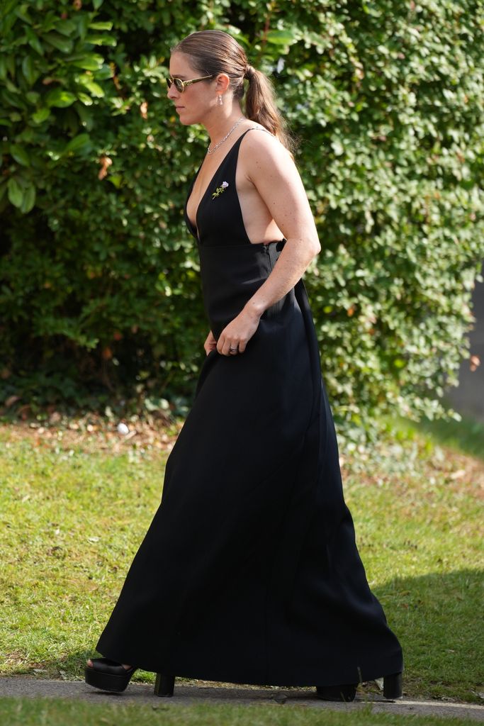 Guests arrive at the wedding of Eve Jobs to Harry Charles at St Michael's and All Angels Church, Great Tew, Oxfordshire, UK, on the 26th July 2025.