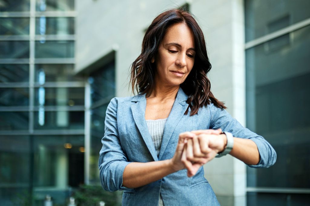 woman looking at watch