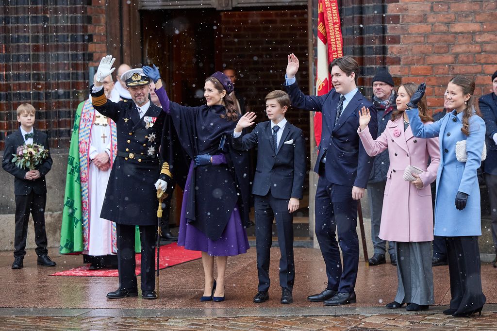 King Frederik X, Queen Mary, Prince Vincent, Crown Prince Christian, Princess Isabella and Princess Josephine greet the crowd after a church service 
