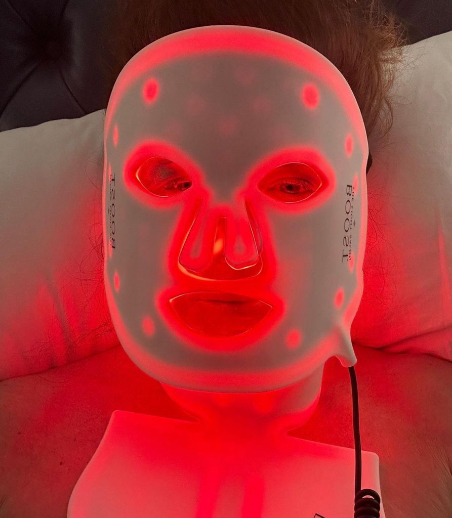 Debra Messing: "I am WRAPPED in red light. I've loved this The Light Salon face mask, and now I have the neck and chest one. I wonder if they’ll make pants?"