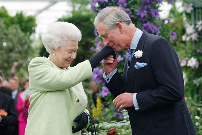the queen and prince charles kissing hand
