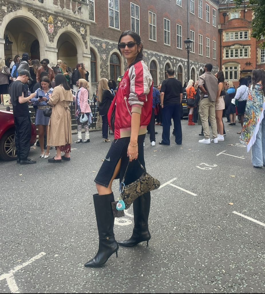 Wgirl in black boots, denim skirt and bomber jacket 