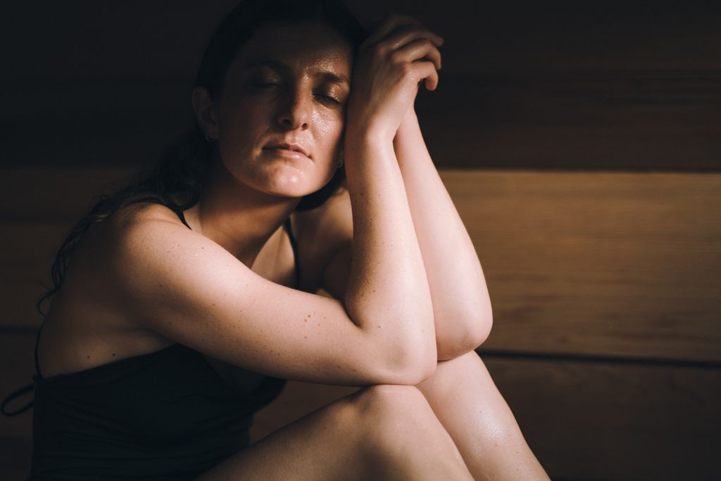 woman looking warm in a sauna