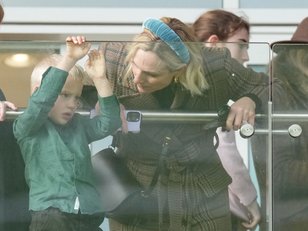 Zara Tindall having a mum moment at the races