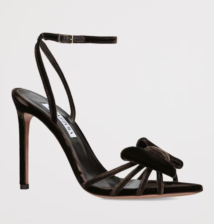 Meghan wore the Aquazzura 'Brown Velvet Bow Tie Heeled Sandals 105'