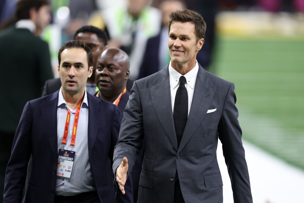 Tom Brady walks across the field before Super Bowl LIX between the Kansas City Chiefs and the Philadelphia Eagles at Caesars Superdome on February 09, 2025 in New Orleans, Louisiana.