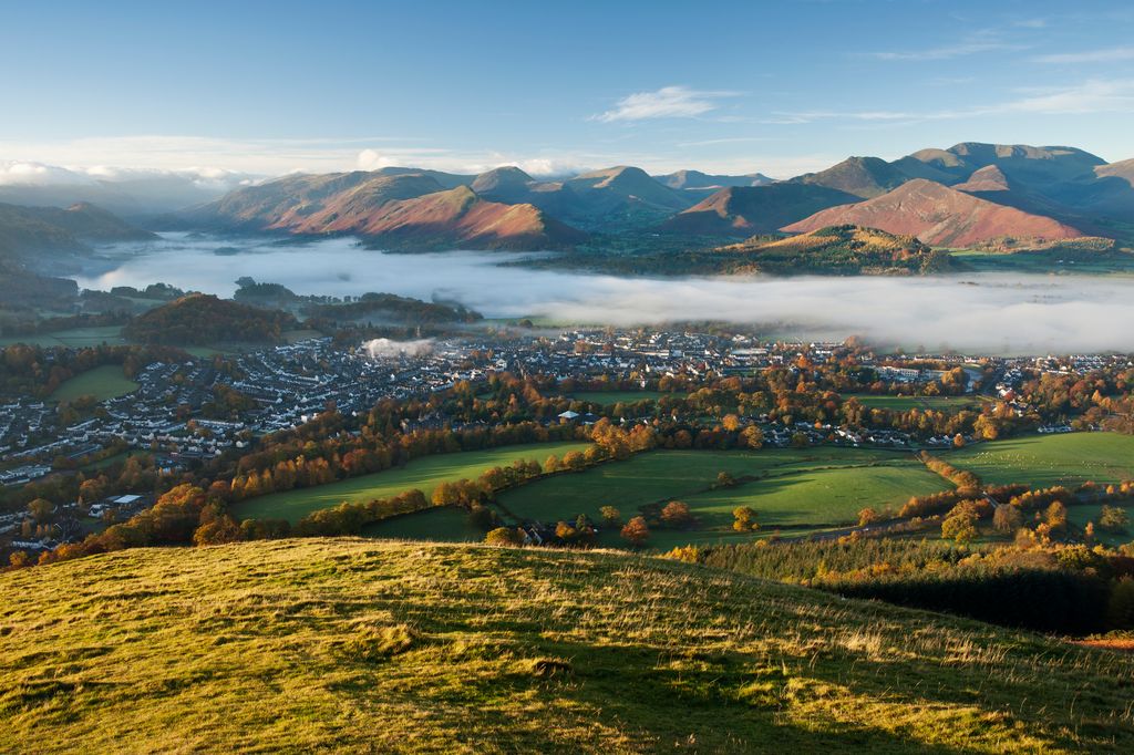 A misty morning across Derwent Water from Latrigg, Keswick in the Lake District, Cumbria, England, UK