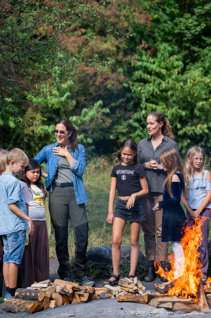 Mary and the students sat around a campfire