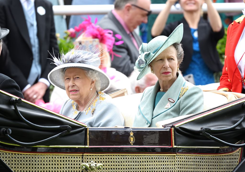 The Queen and Princess Anne riding in a carriage