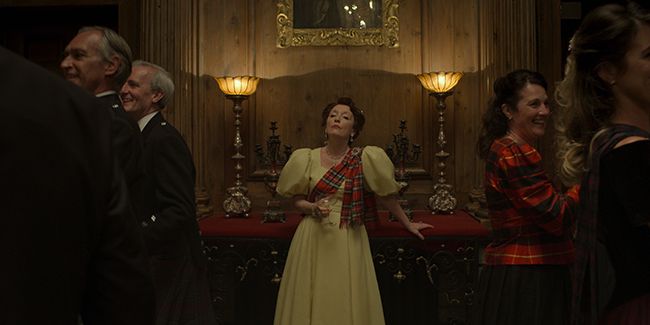 Lesley Manville as Princess Margaret in yellow dress in the crown