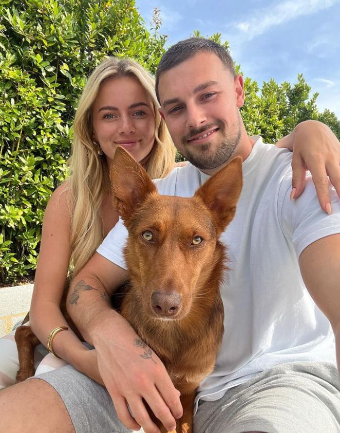 Tasha Ghouri and Andrew Le Page with a brown dog