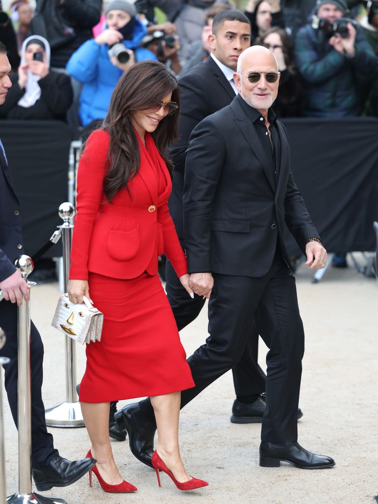 Jeff Bezos and Lauren Sánchez Bezos holding hands at Paris Fashion Week