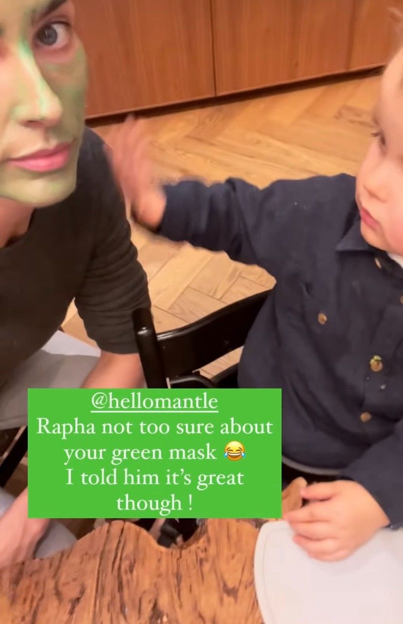 Raphael wiping at his mum Frida Redknapp's green face